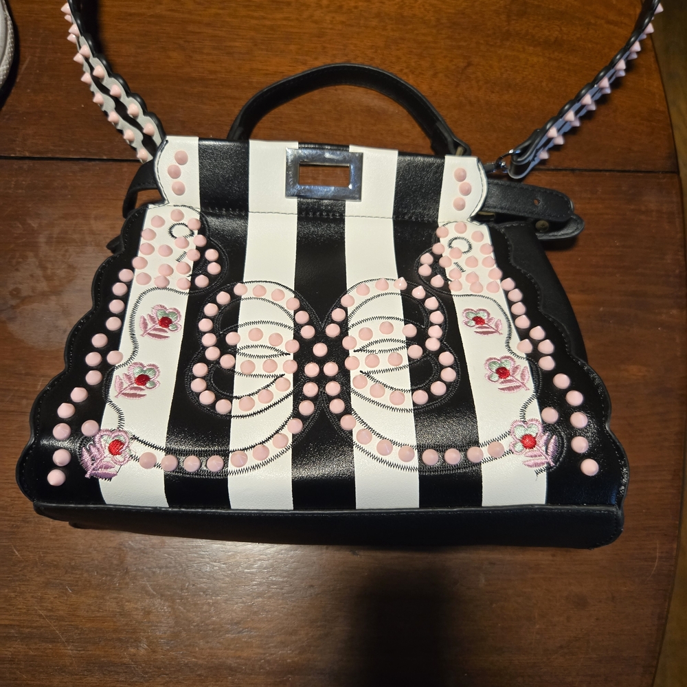 Elegant Striped Shoulder Bag with Pink Accents